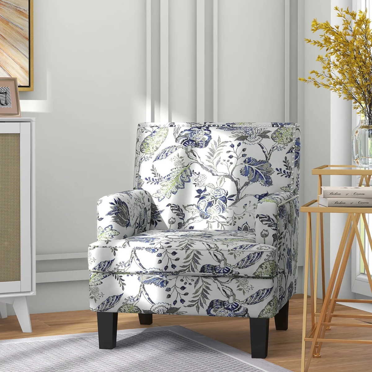Comfortable accent chair with floral design and dark wooden legs in a cozy interior.