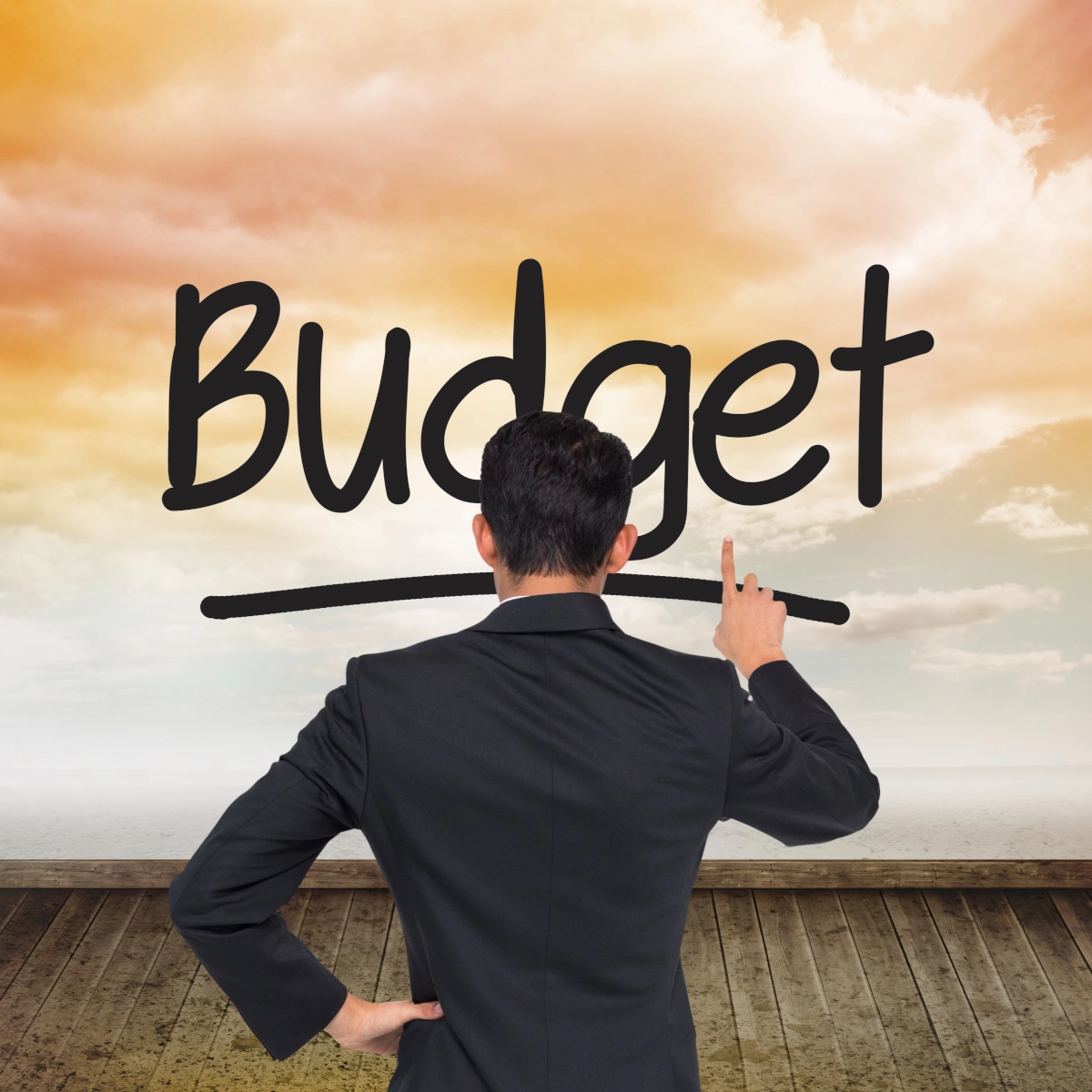 Person in suit adjusting budget concept, focusing on financial planning.