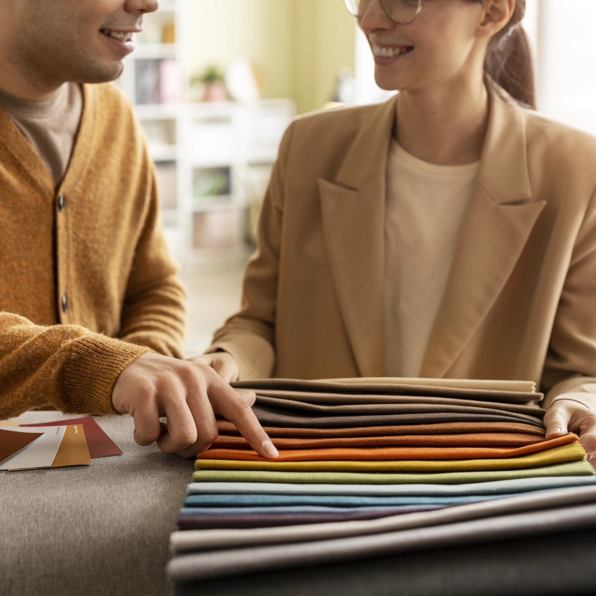 Couple selecting fabric swatches for outdoor shade sails.