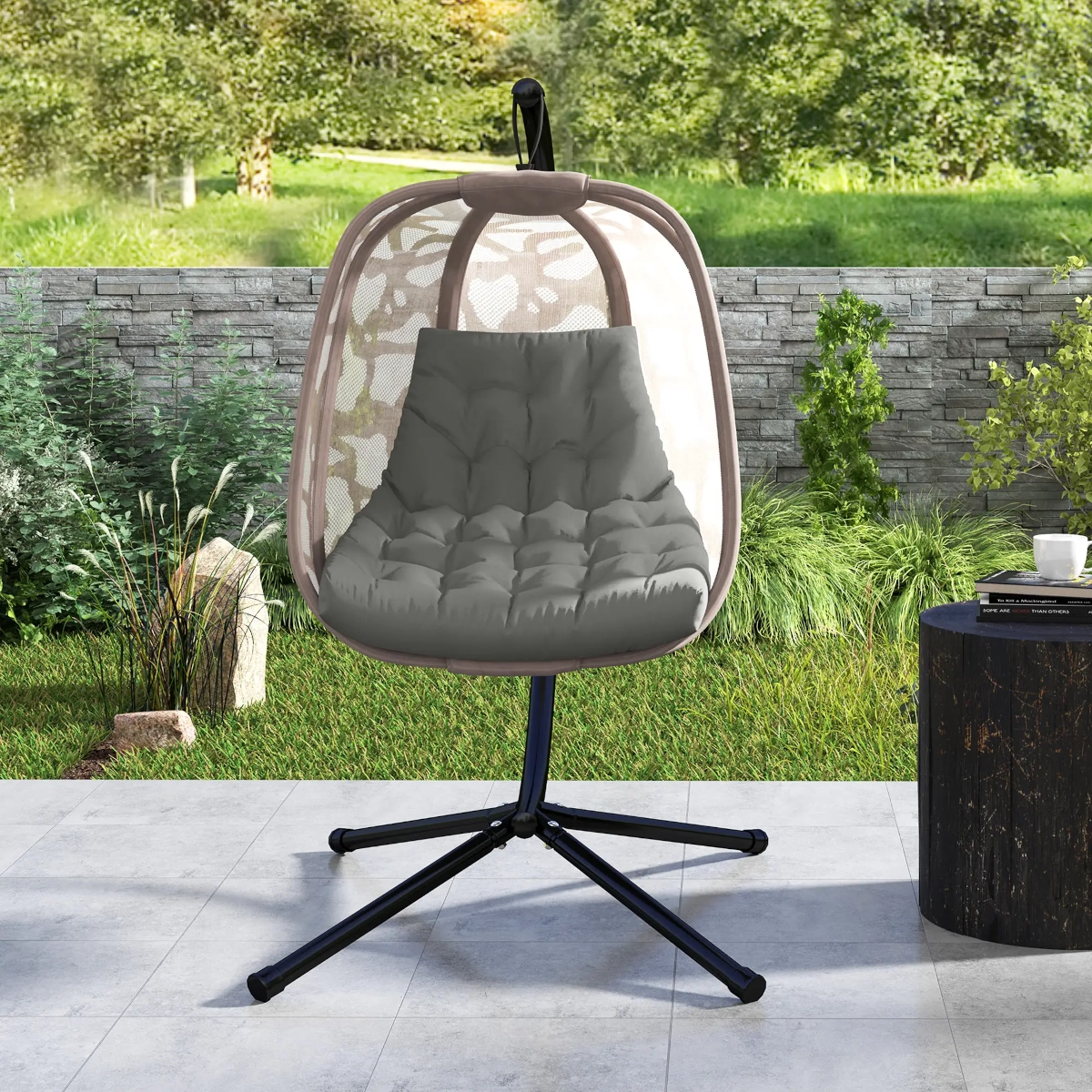Outdoor egg chair with cushion placed in a garden, ready for cleaning and maintenance.