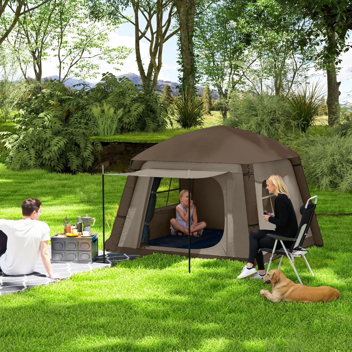 Inflatable tent with air beam structure standing on grass with trees in background.