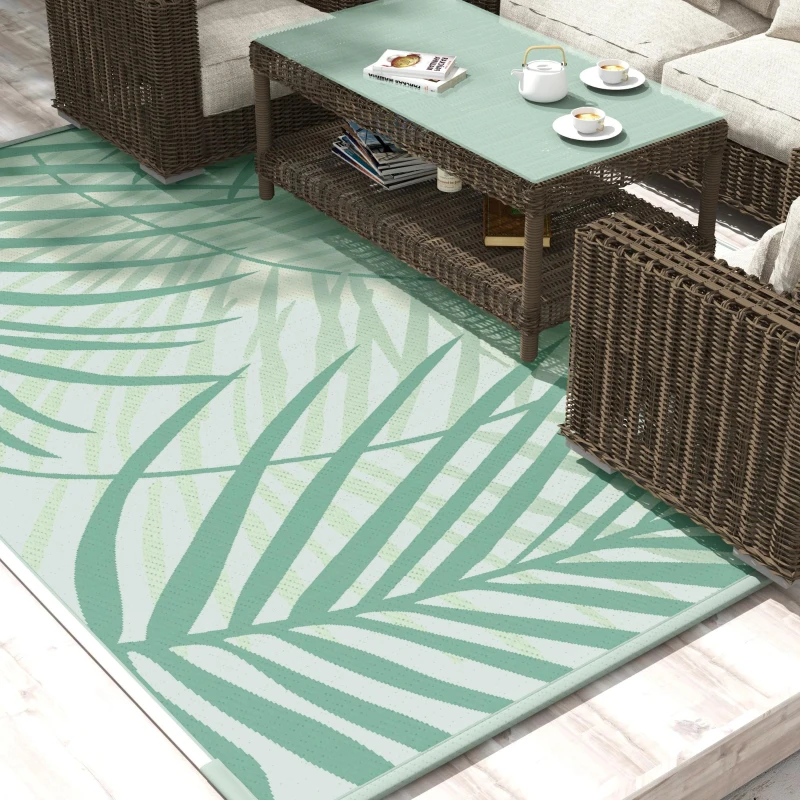 Outdoor dining set on durable rug, perfect for Canadian climates and seasonal changes.
