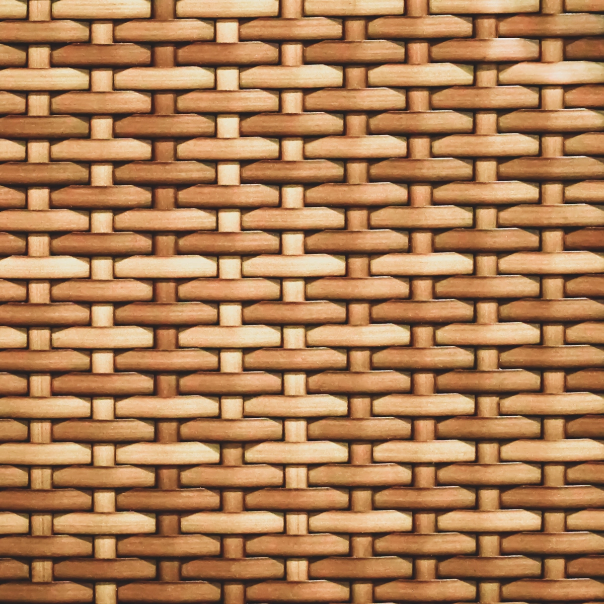 Detailed view of traditional rattan material showcasing woven organic texture pattern.