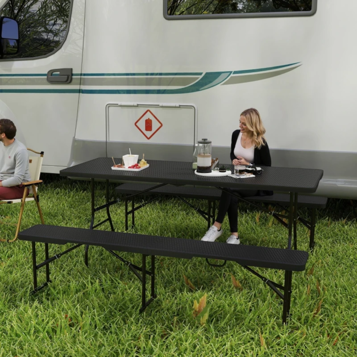 Stylish faux rattan folding table set with benches ideal for modern outdoor gatherings.