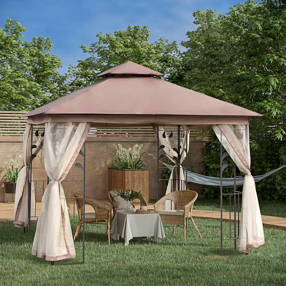 Beige gazebo with curtains and a table for outdoor relaxation in a lush garden.