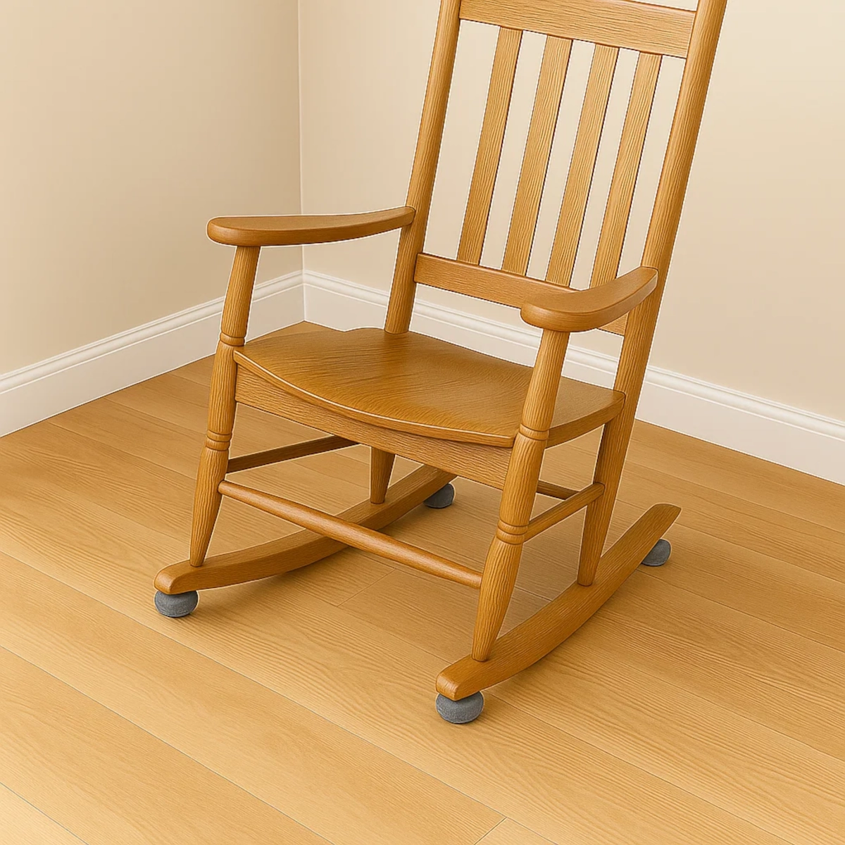 Rocking chair with gray felt glides attached to rocker ends, protecting hardwood floor from scratches.