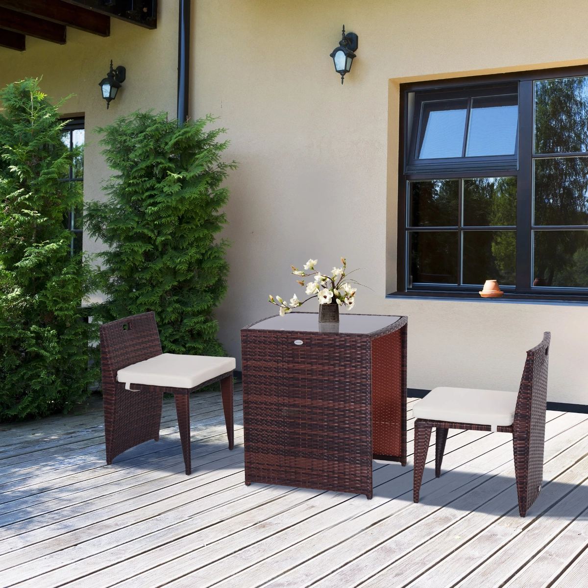 Charming outdoor bistro set with cushioned chairs and round table for compact patios