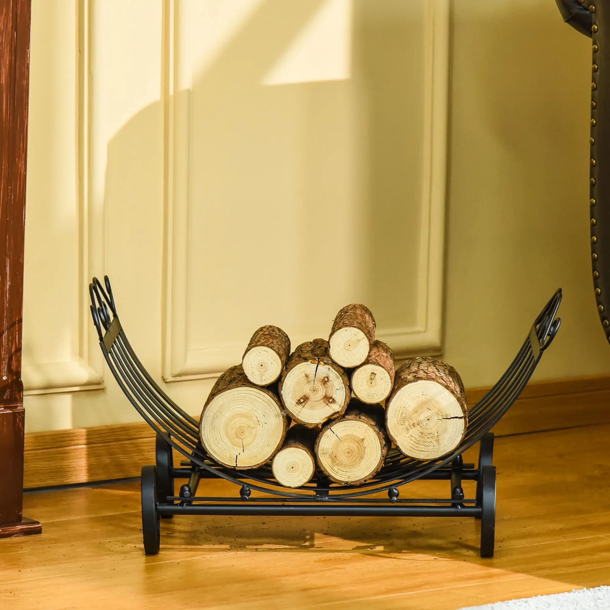 Elegant curved metal firewood holder with wheels and vertical bars, filled with split logs indoors.