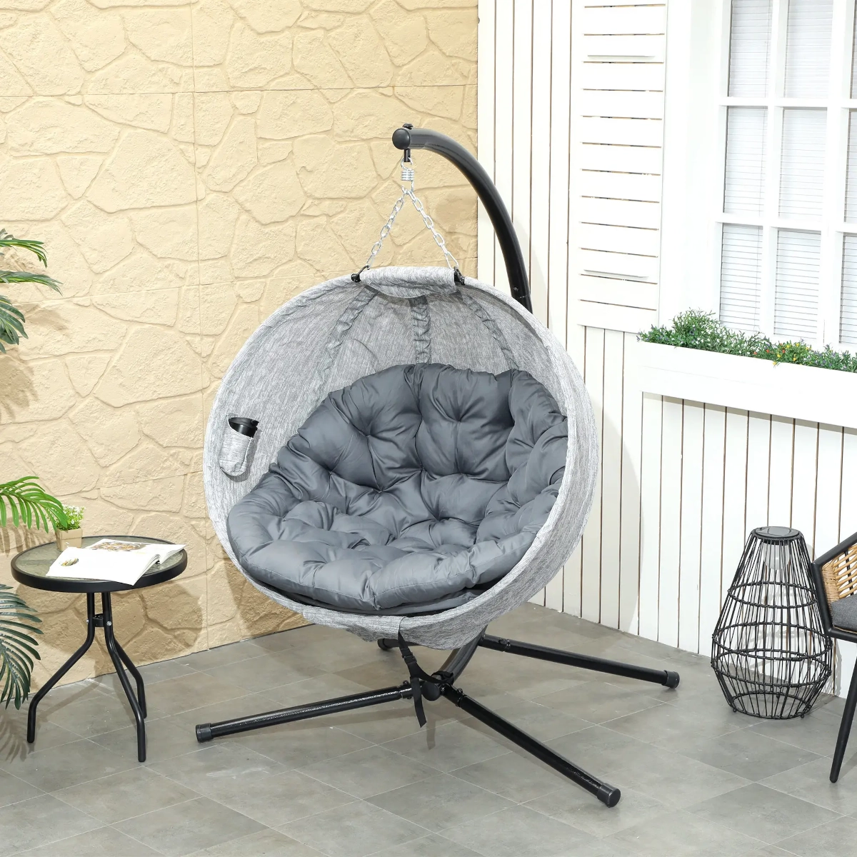 Foldable egg chair with collapsible basket design, perfect for compact storage and lounging.
