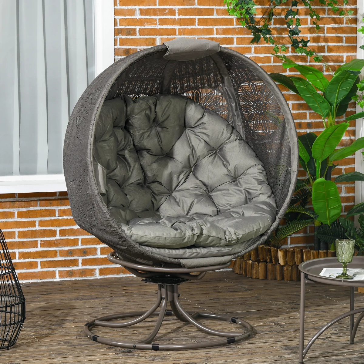 Modern egg chair with cushioned seat and swivel metal base for versatile indoor comfort.