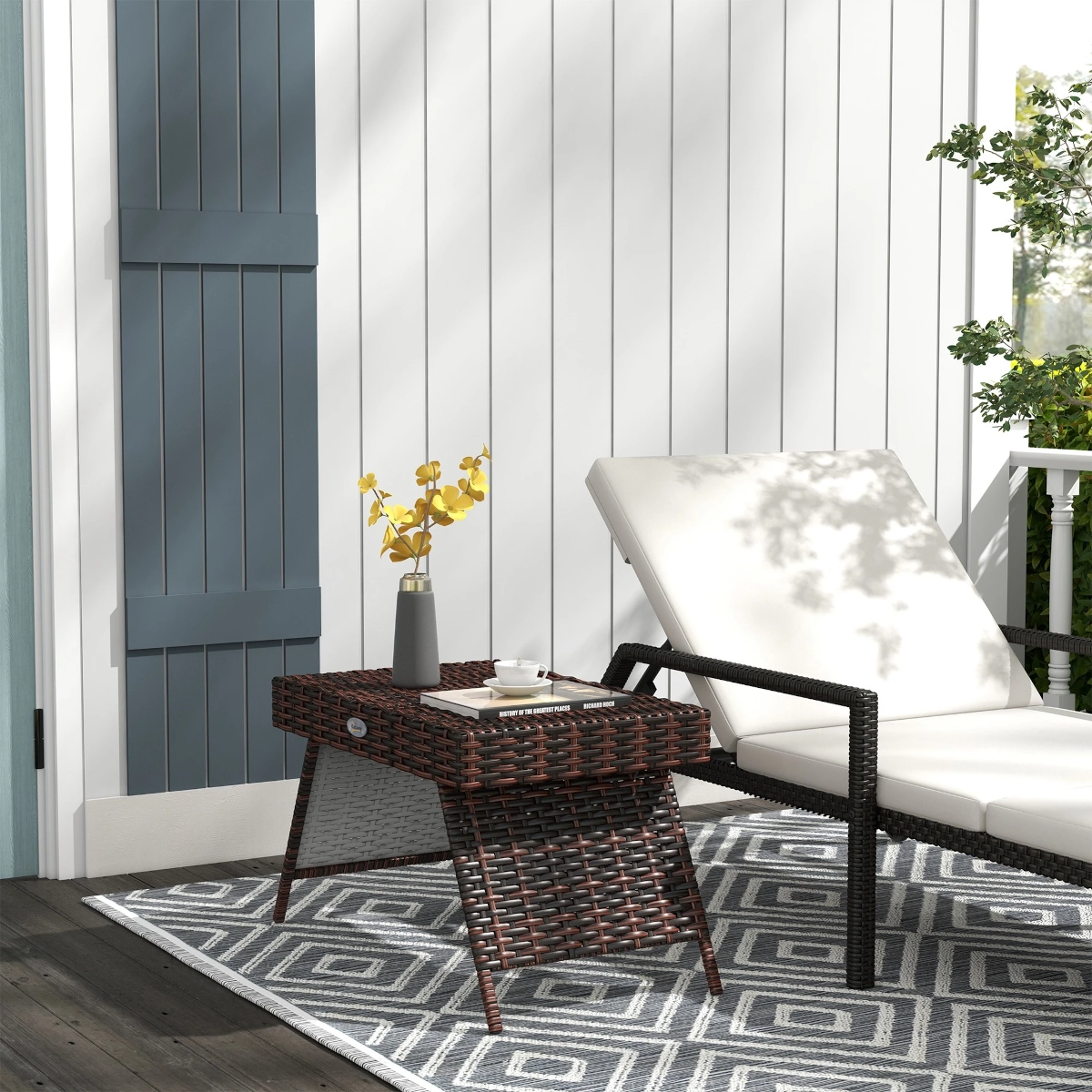 Foldable rattan end table with a clean design, ideal for portable outdoor use.