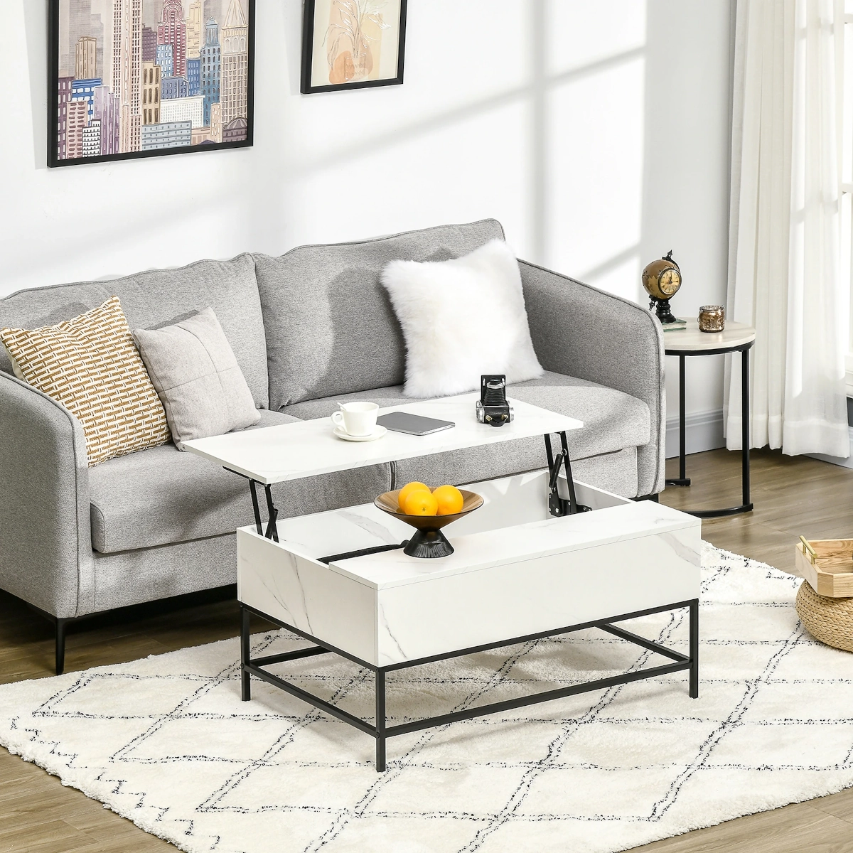 Modern living room with a marble top coffee table and light gray sofa on patterned rug.