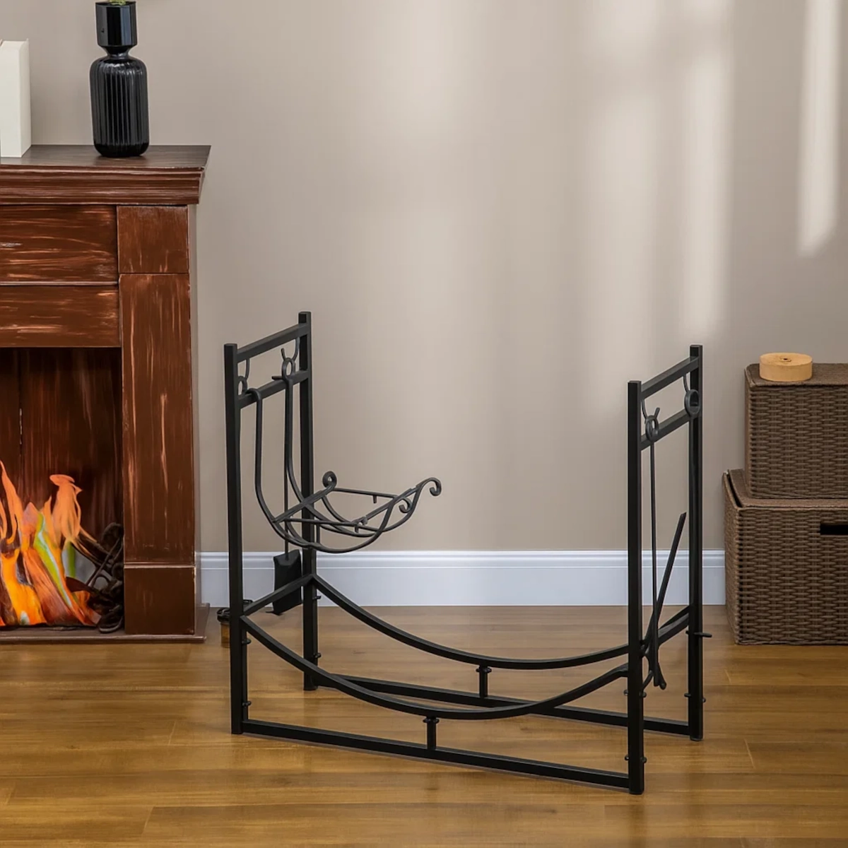 Black firewood rack placed near indoor fireplace with decorative accents.