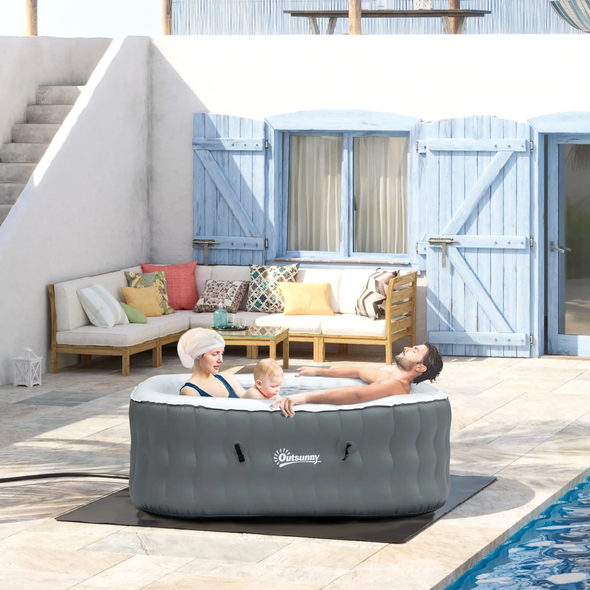 Family-size inflatable pool inflated and set up in backyard for casual summer fun.