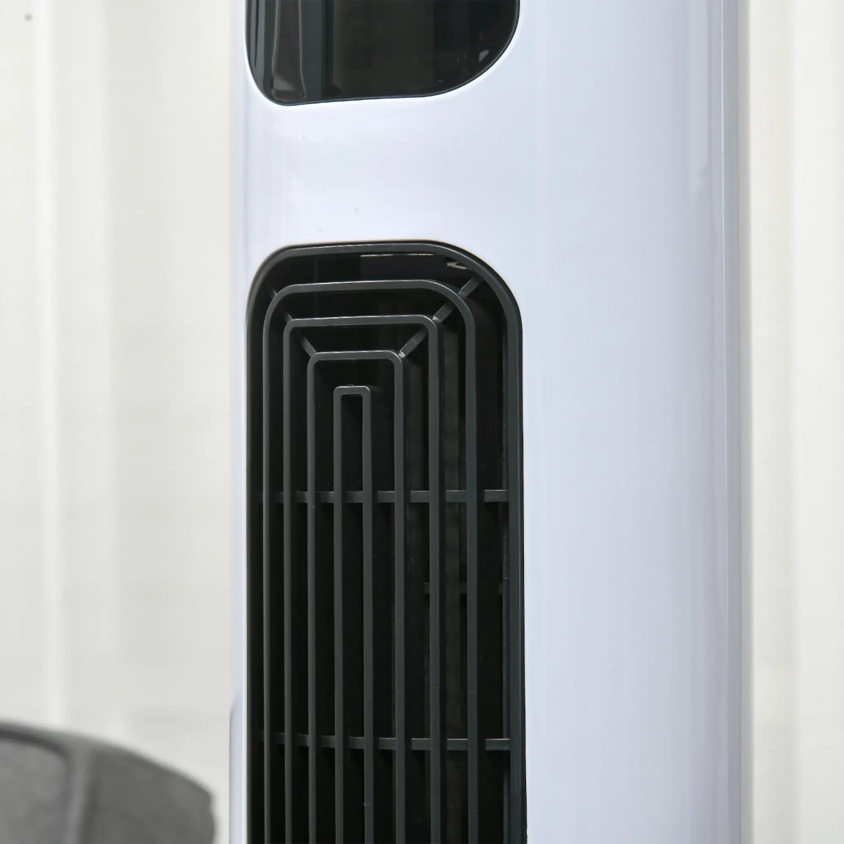 Compact tower fan with slim, space-saving design.