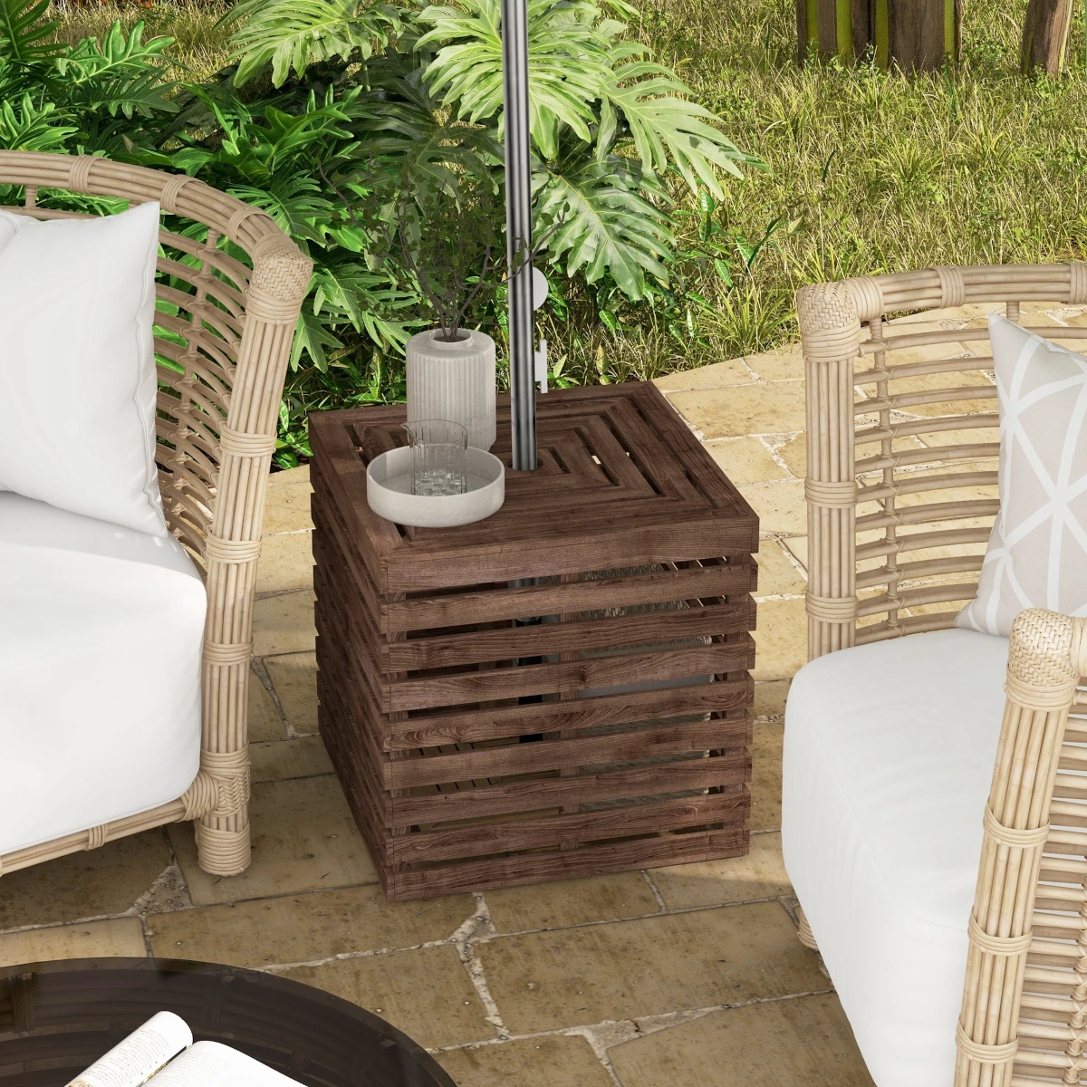 Round umbrella base storage unit placed under patio umbrella on tiled outdoor flooring.