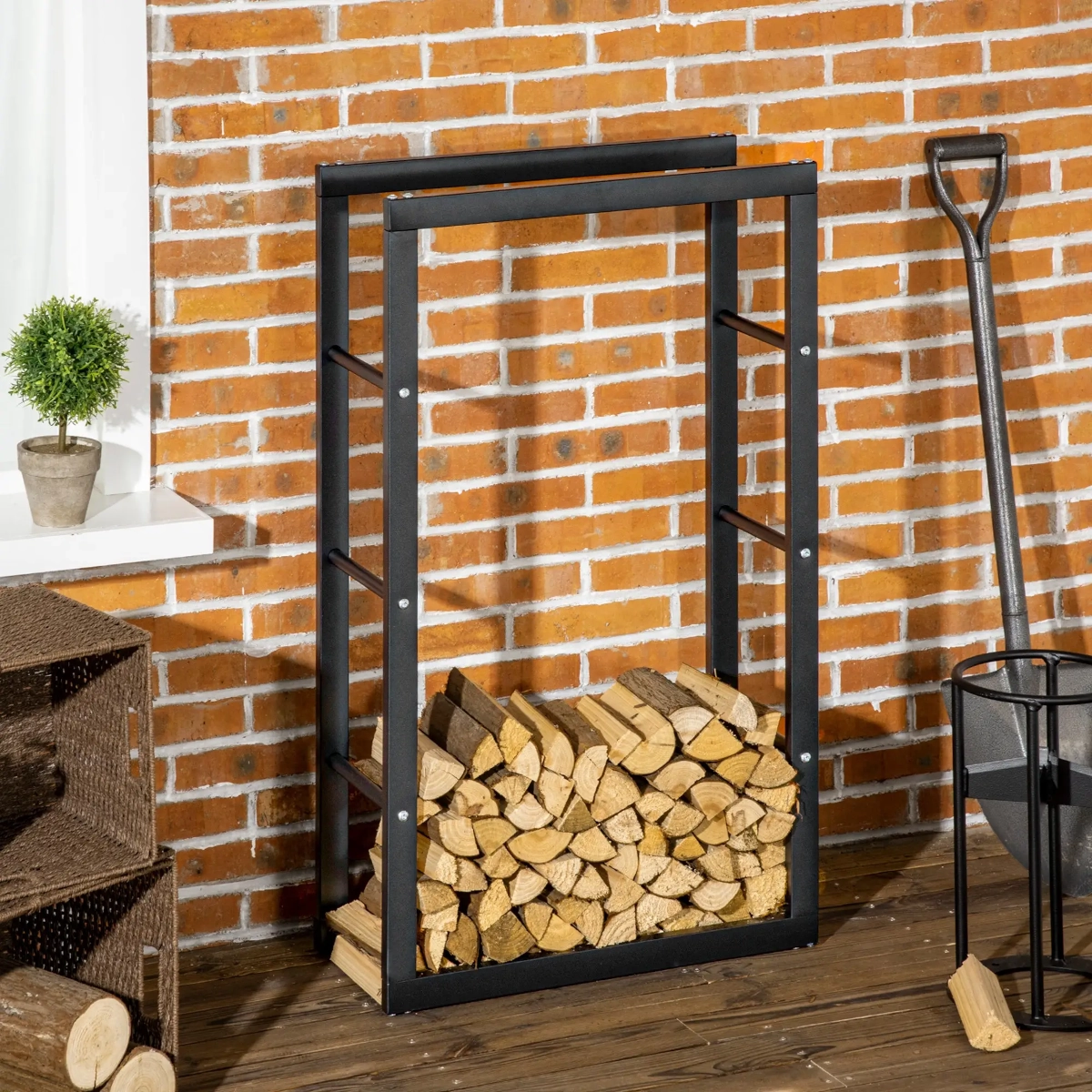 Indoor rectangular firewood rack stacked with triangular-shaped split logs beside a grey wall and fireplace.