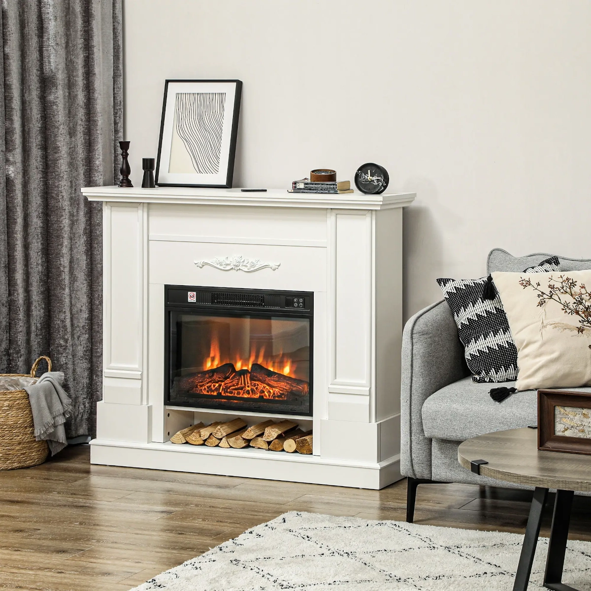 White electric fireplace with a stone-style frame and shelf top, decorated in a bright modern room.