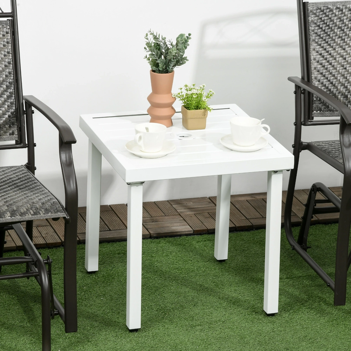 Outdoor table with umbrella hole, ideal for sun protection and garden setups.