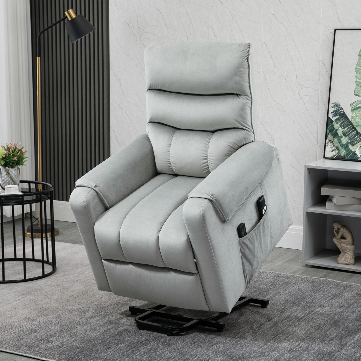 Soft grey lift recliner chair with plush padding and ergonomic design in a modern living space.