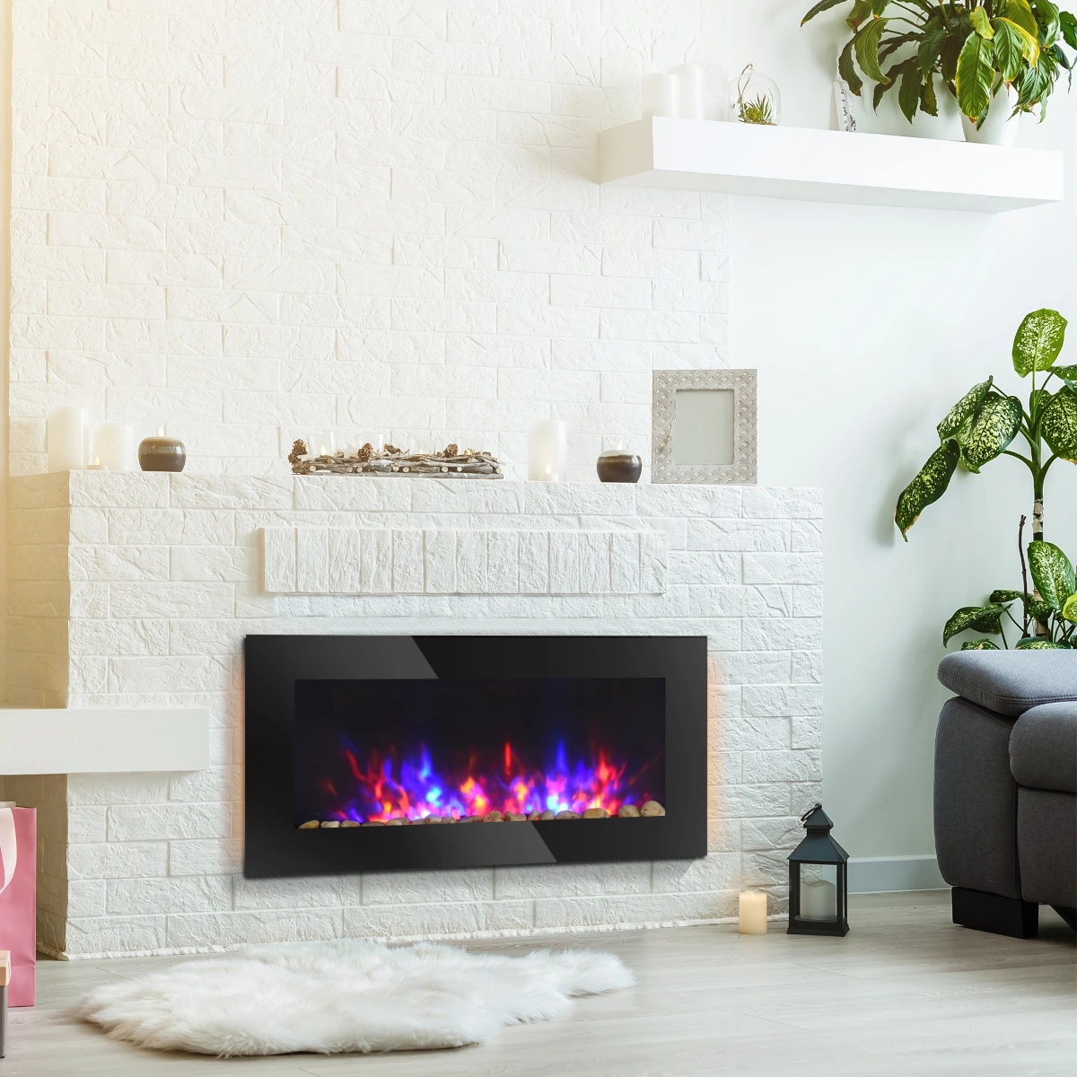 Modern living room with electric fireplace, white brick wall, indoor plants, and cozy decor.