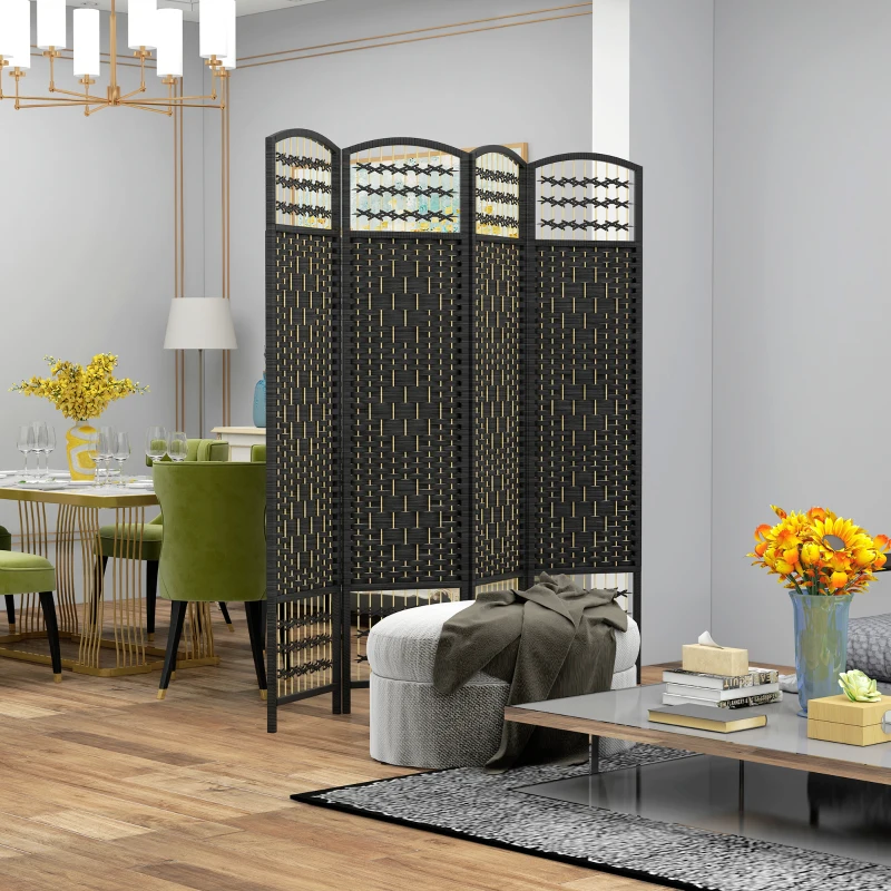 Black woven folding room divider separating dining area from living space with cozy, modern decor.