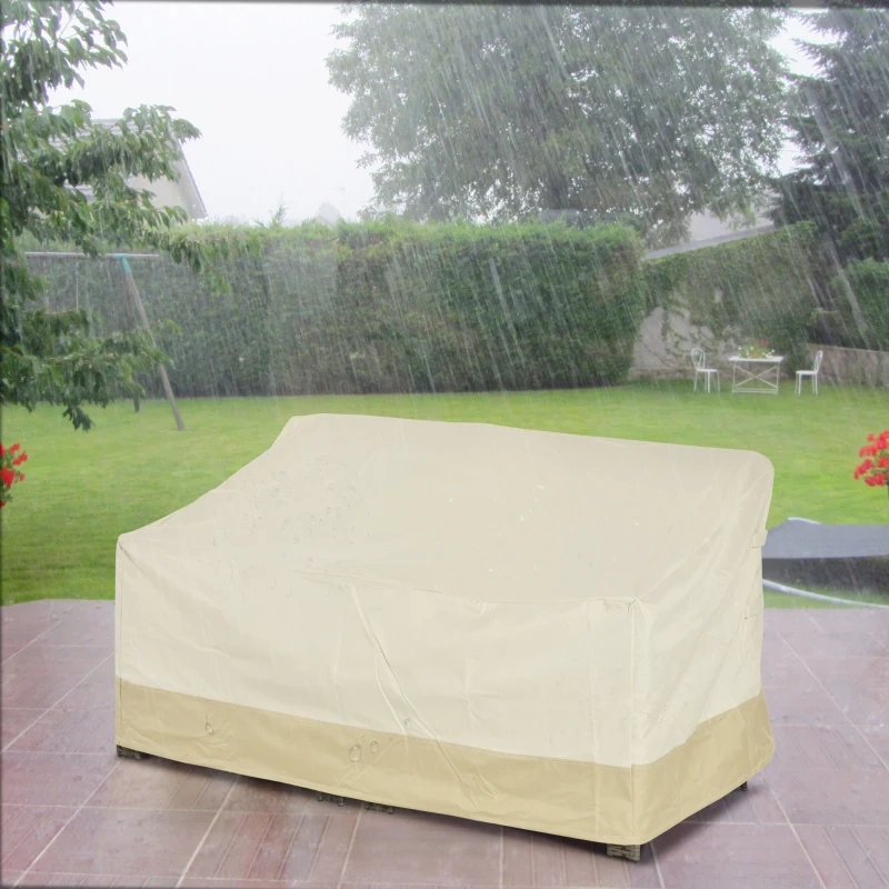 Beige cover shielding outdoor bench in rain