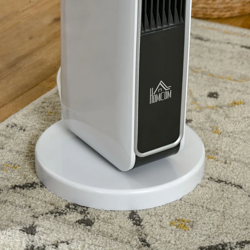 Close-up of ceramic tower heater base placed on a patterned carpet.