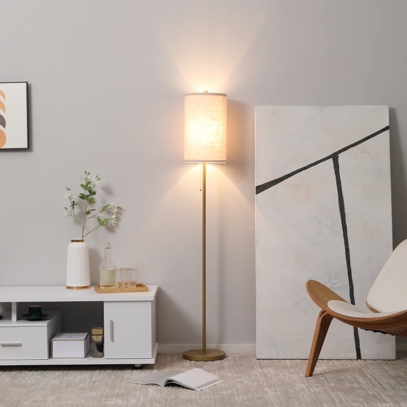 Modern floor lamp with decorative shade glowing warmly, styled as a focal point in a living room.