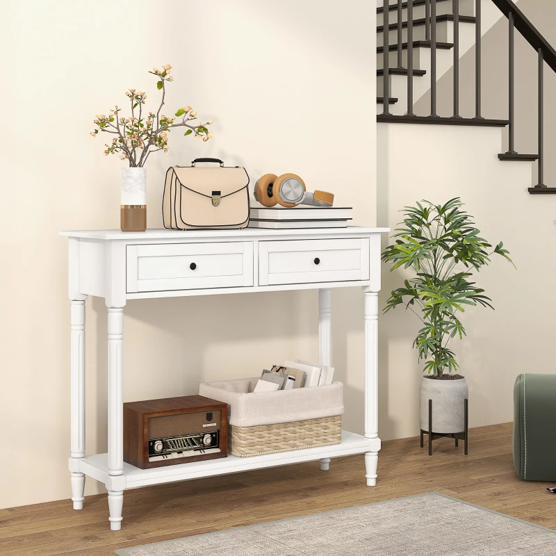 White console table with drawers and bottom shelf styled in a cozy living room corner.