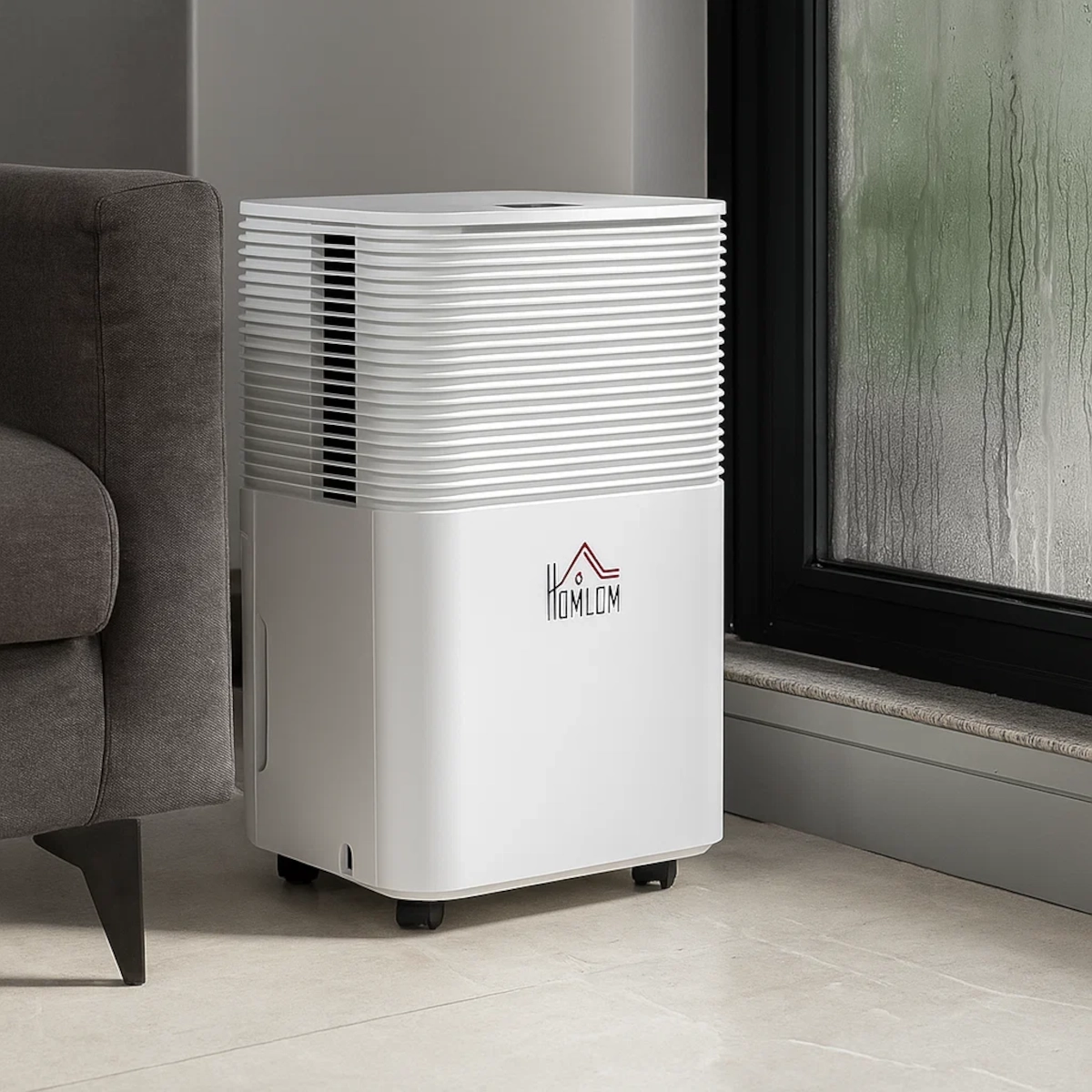 White HOMCOM dehumidifier next to fogged window, reducing indoor humidity near a grey sofa.