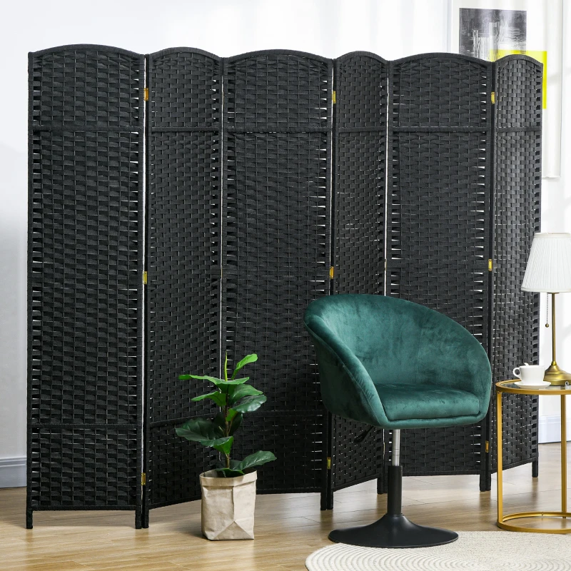 Black woven panel room divider in modern seating area with green velvet chair.
