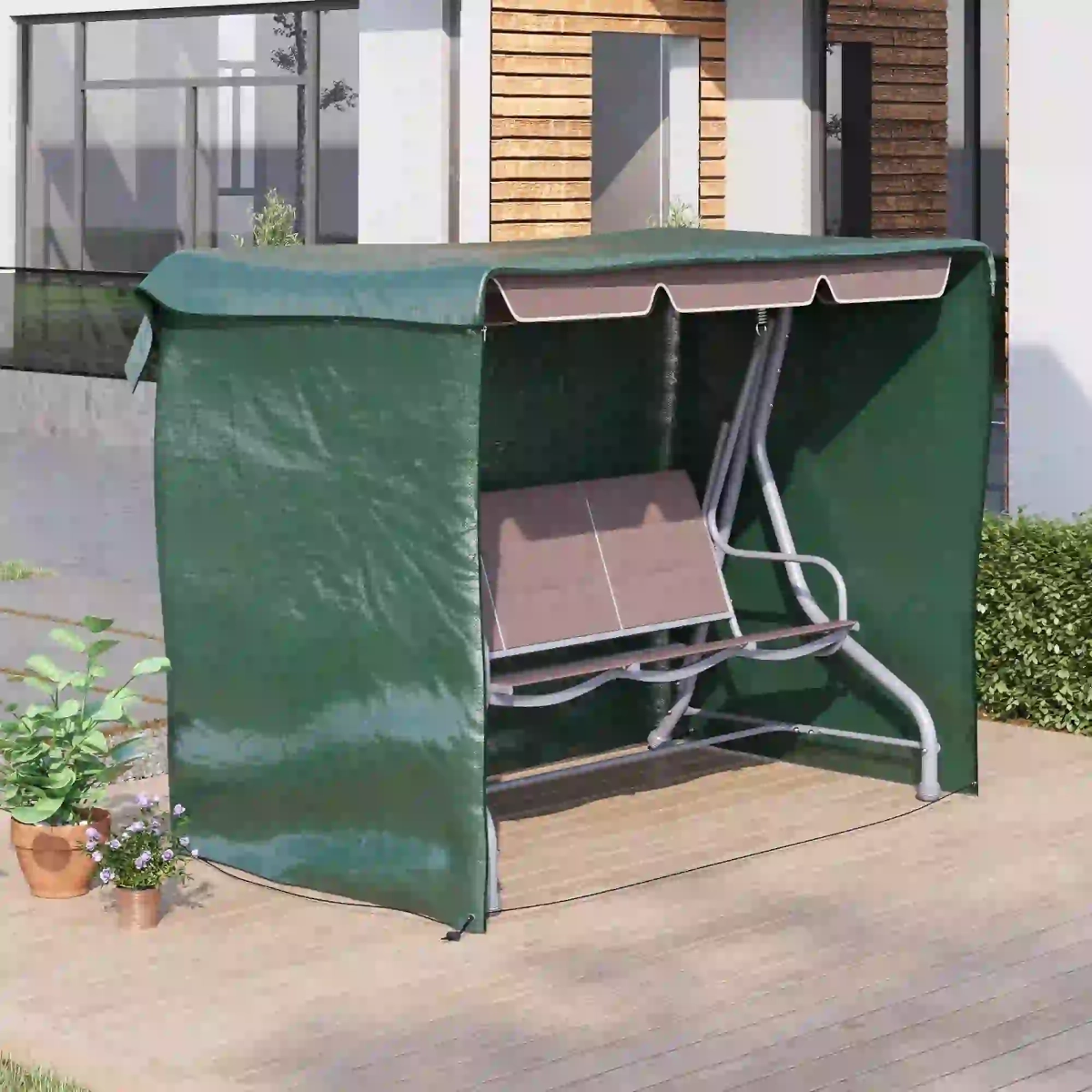 Green cover enclosing outdoor swing chair