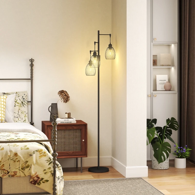 Floor lamp next to bed and wooden nightstand with books and décor.